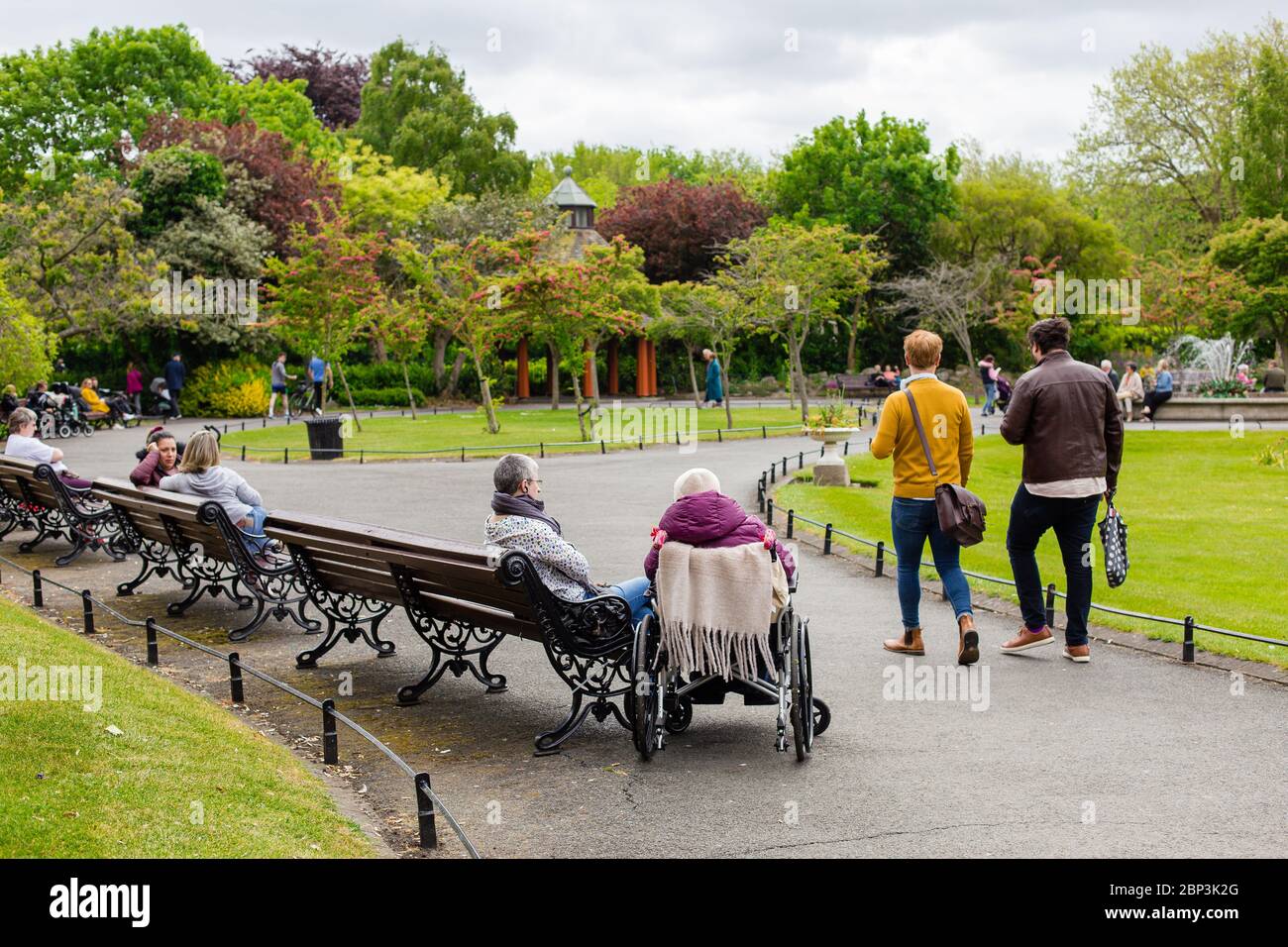 People in the St. Stephen`s Green Park in Dublin adhering to social distancing rules on the last day before 1st Phase of easing COVID-19 restrictions. Stock Photo